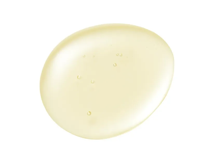 淡い黄色のとろみのある液体が滴り落ちたような画像